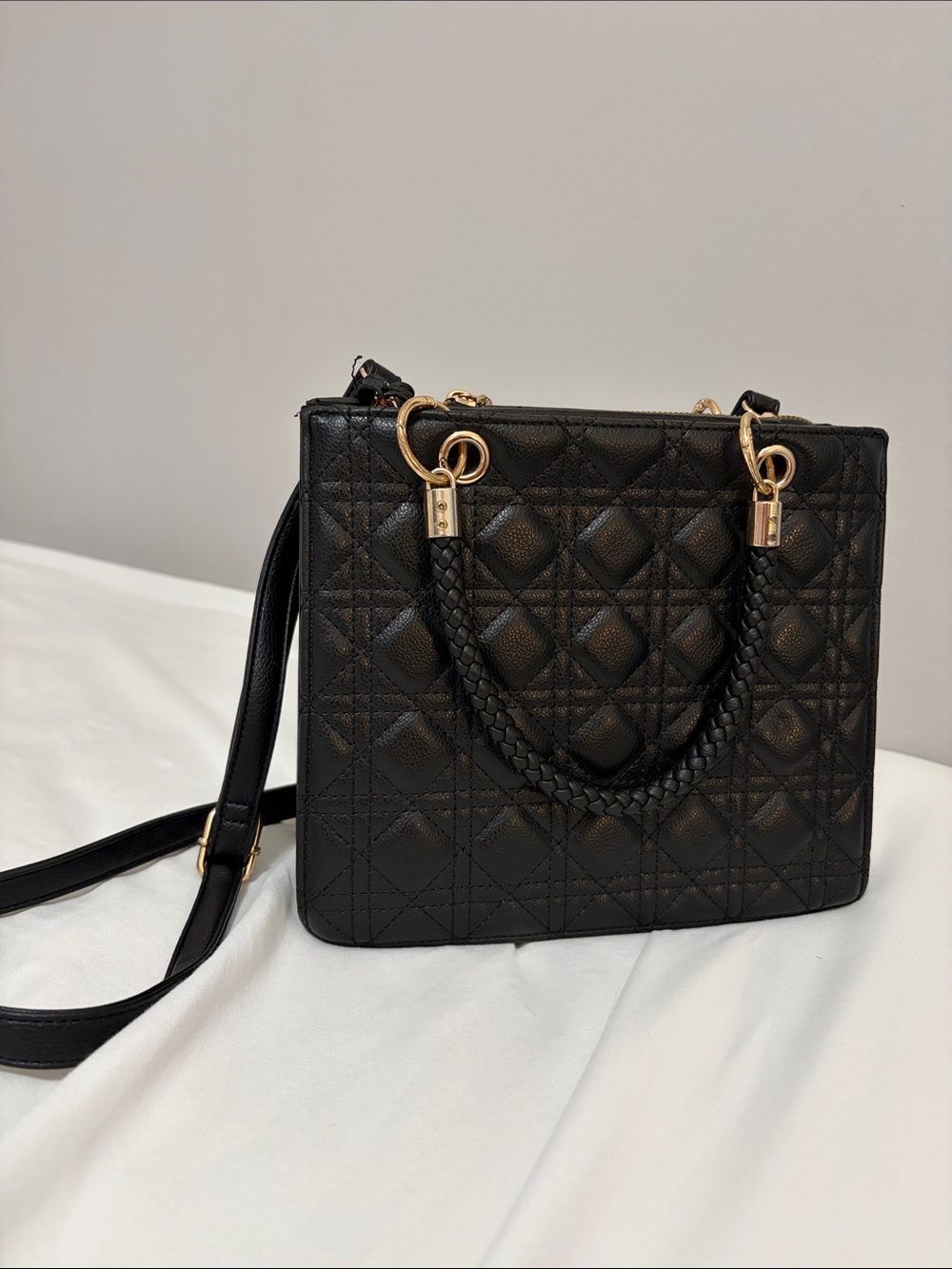 Black Quilted Shoulder Bag with Braided Top Handle and Gold Accents